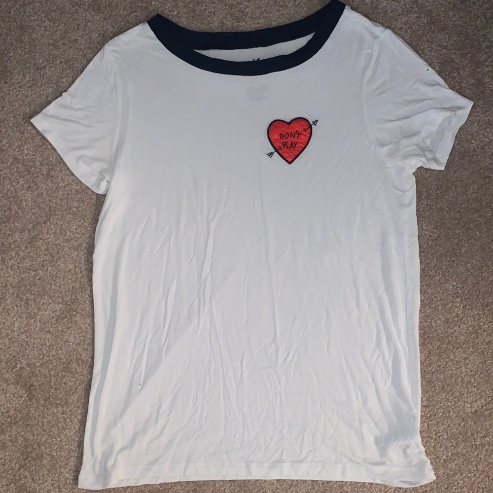 Cute tee with navy collar and heart patch